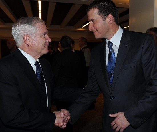 Defense Secretary Robert Gates (left) is greeted by Dan Tel Aviv general manager Etai Eliaz as he arrives for a formal dinner with Israel Defense Minister Ehud Barak. The IDF chief of staff, the head of Israels military intelligence and the U.S. ambassador joined them in the newly renovated hotel restaurant.