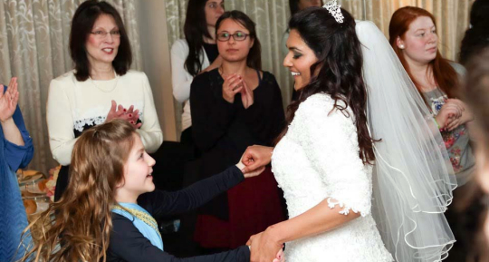 Nina watches as AnnaRuth dances with Trupthi