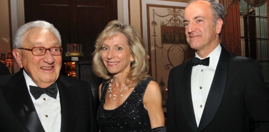 Henry Kissinger, Anna Schneider, vice president of Volkswagen Group of America government relations, and David Geanacopoulos