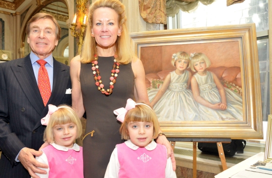 Dr. Sherrell Aston and Muffie Potter Aston with their daughters Bracie and Ashleigh and a portrait of the twins