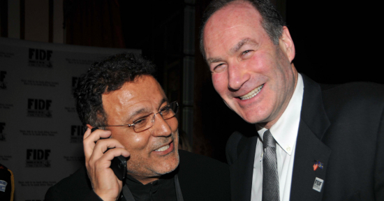 Fashion designer Elie Tahari on the phone with Jeffrey Wiesenfelds wife.