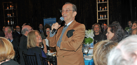 Joel Grey singing to the audience
