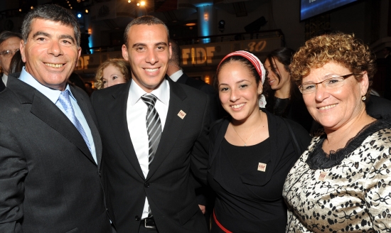 Lt. Gen. Gabi Ashkenazi with Miriam Peretz and her children, Avichai and Bar-El. Photo by Shahar Azran