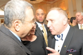 With wife Nili in the middle, Ehud Barak gets an earful from Gabriel Erem, publisher of Lifestyles magazine, but they end their pow-wow cheerfully.