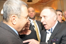 With wife Nili in the middle, Ehud Barak gets an earful from Gabriel Erem, publisher of Lifestyles magazine, but they end their pow-wow cheerfully.
