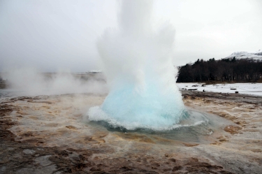 Strokkur hot springs erupting