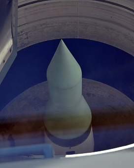 Thats a Minuteman missile buried in the rural landscape
