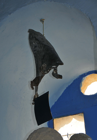 Katyusha rocket remnant in window of Joseph Caro