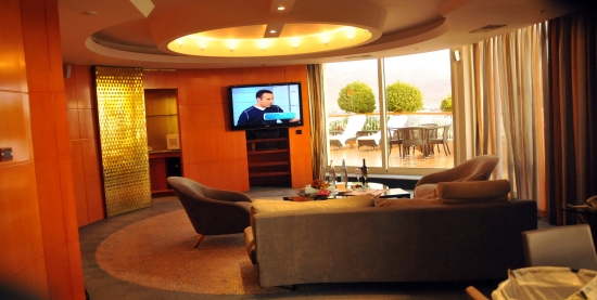 Presidential Suite with kitchen at left and patio at right
