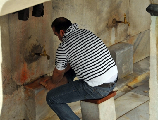Washing feet as well as face, mouth, neck and arms are an essential ritual before prayer